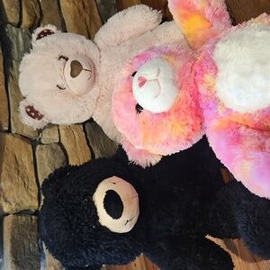 Three build a bear animals. pink and black bears